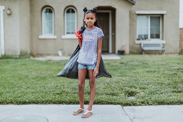 sad girl with trash bag