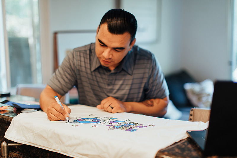 original_images/man-decorating-superhero-pillowcase-2.jpg